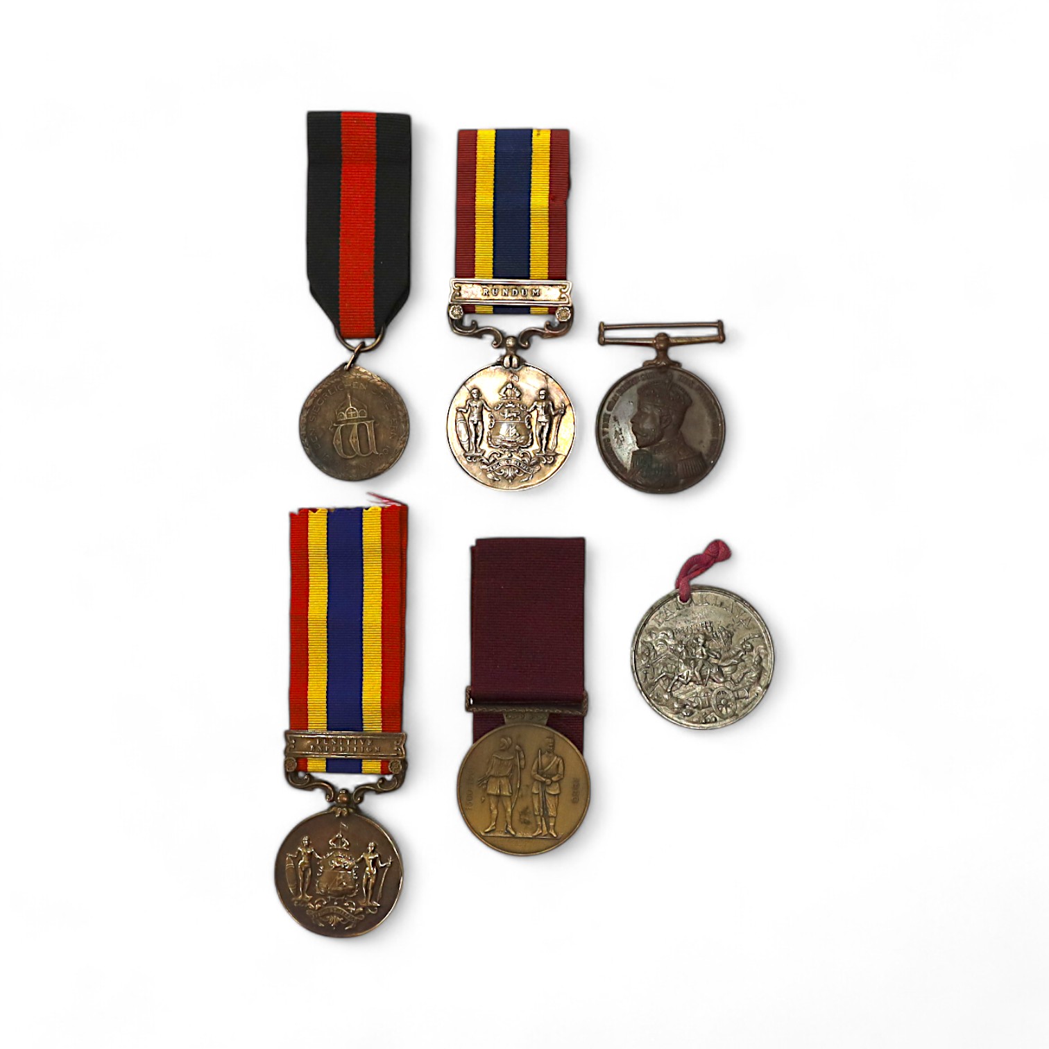 Assorted medals; two replica British North Borneo medals; Balaklava medallion; bronze GV medal; German China Campaign medal; bronze NRA medallion, unnamed